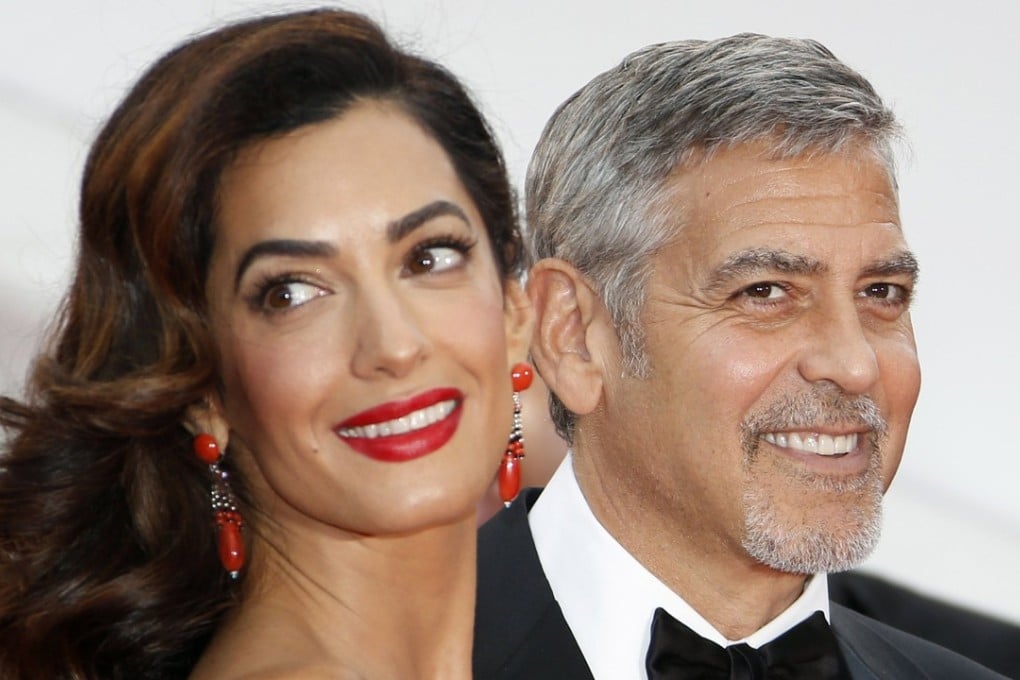 US actor George Clooney and wife British human rights barrister Amal Clooney, who gave birth to baby twins, daughter Ella and son Alexander, on June 6. Photo: EPA