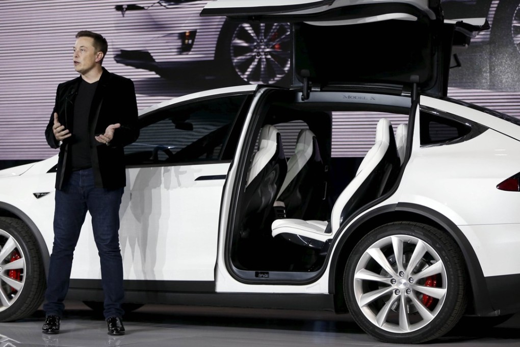 Tesla Motors CEO Elon Musk introduces the falcon wing door on the Model X electric sports-utility vehicles during a presentation in Fremont, California. Photo: REUTERS/Stephen Lam