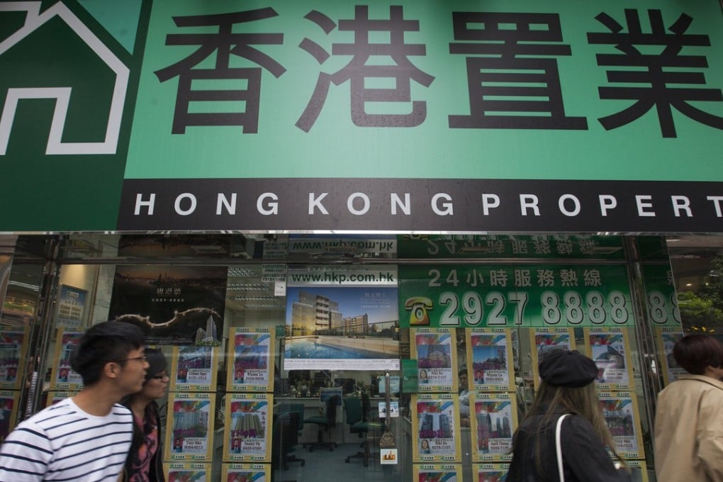 A real estate agent shop in Tsim Sha Tsui, Hong Kong. Is the city about to experience a property crash? Photo: EPA