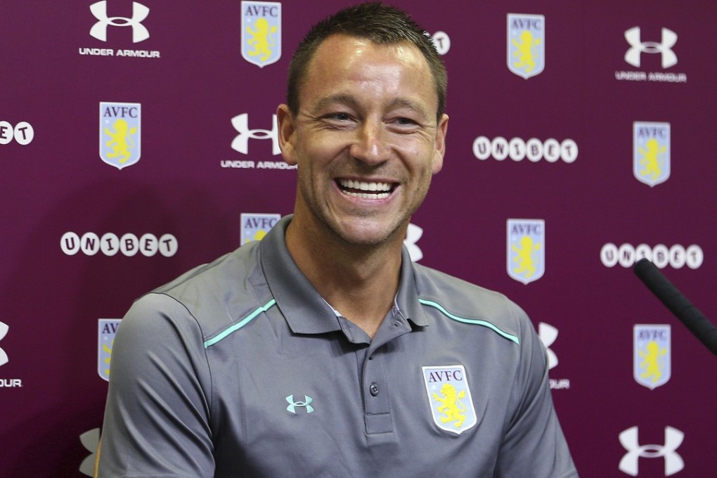 New Aston Villa signing John Terry reacts during a media conference at Villa Park in Birmingham. Photo: AP