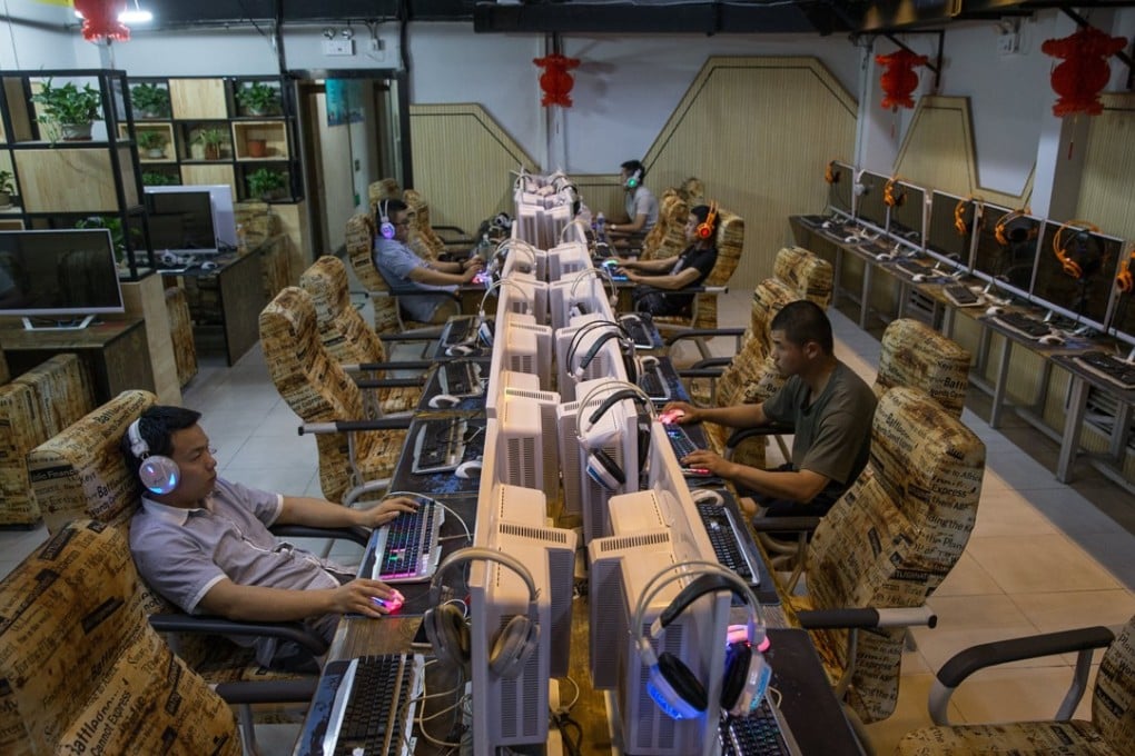 A file picture of people using an internet cafe in Beijing. Photo: EPA