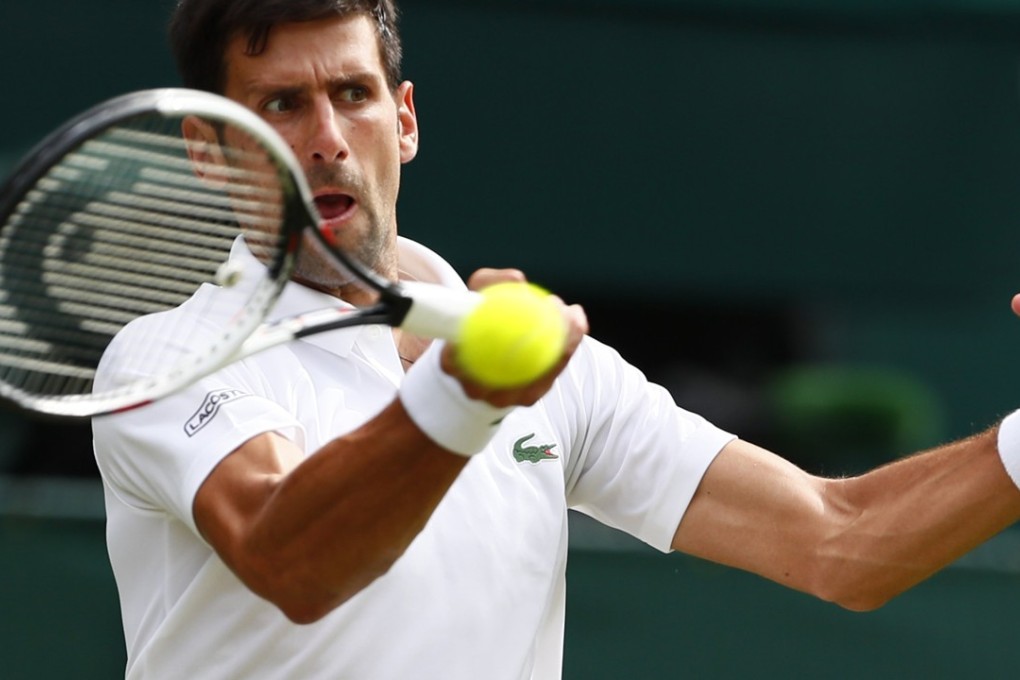 Serbian Novak Djokovic returns to Martin Klizan, of Slovakia, during their first-round Wimbledon clash. Photo: EPA