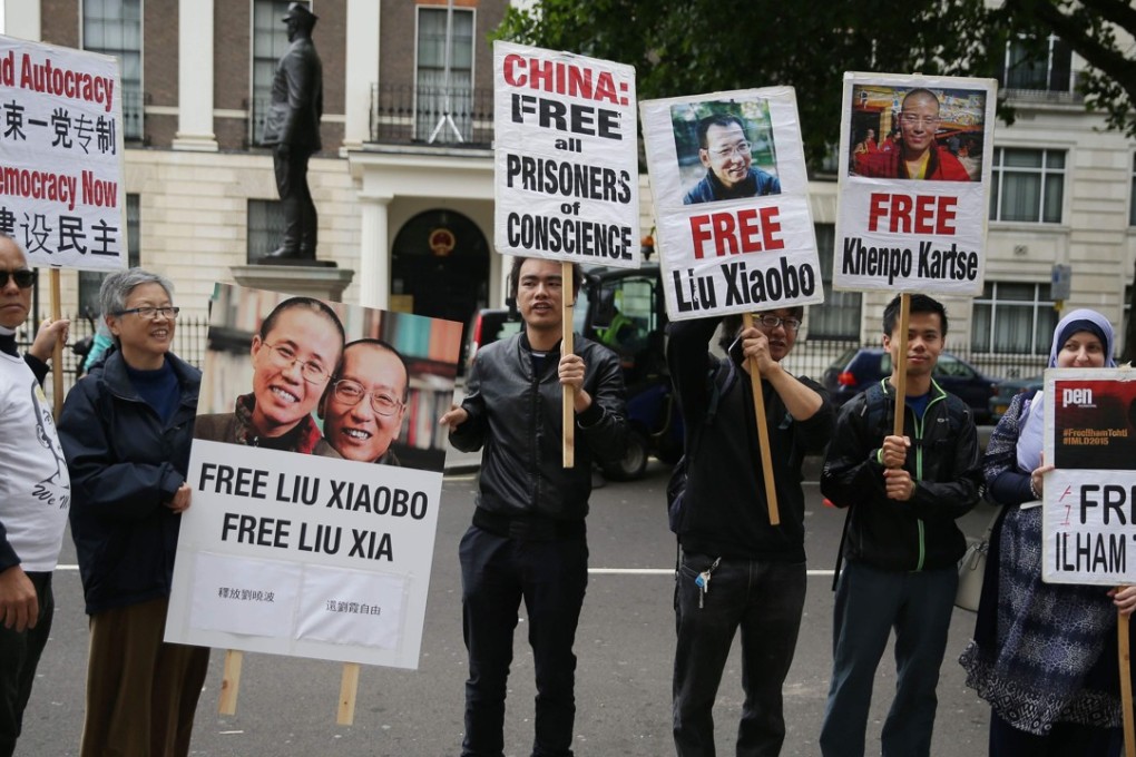 Protesters call for the release of Liu Xiaobo outside the Chinese embassy in central London on July 1. News broke earlier in the week that Liu had been released to a hospital on medical parole after being diagnosed with terminal liver cancer. Photo: AFP