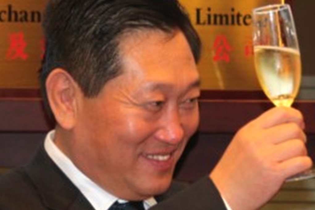 Yang Kai, chairman of China Huishan Dairy, celebrates after the company was listed on the Hong Kong stock exchange in 2013. Photo: Handout