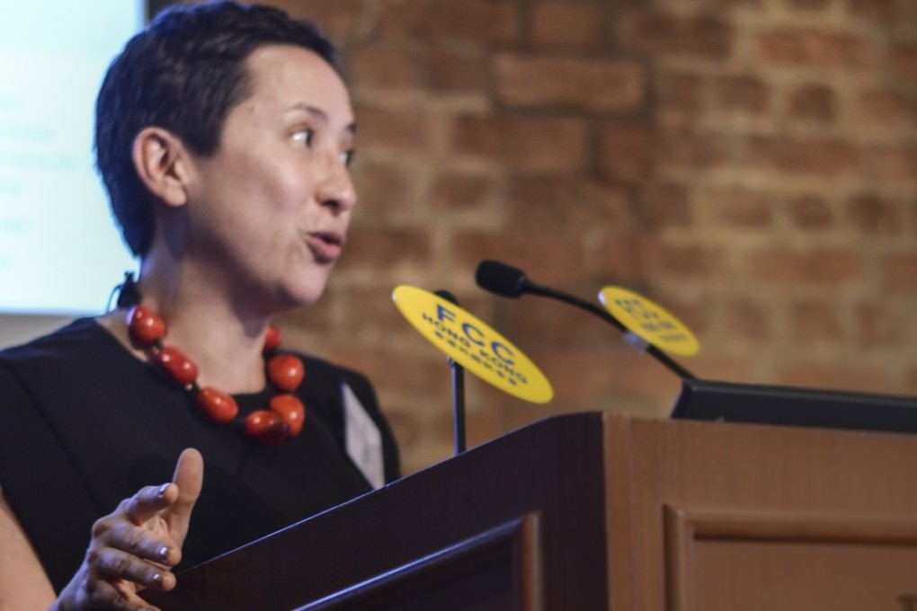 Louisa Lim reading her contribution to Hong Kong 20/20. Photo: FCCHK