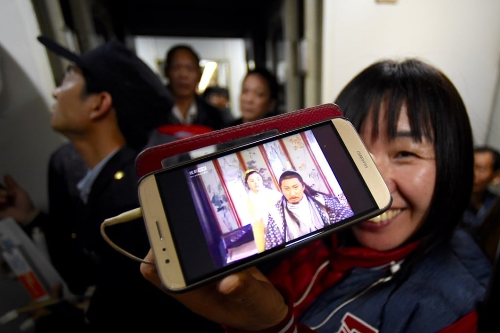 Tencent doesn’t just want gamers and viewers to enjoy its contents on mobile devices, but it also wants them to bring the contents onto their TV screens in their living rooms. Photo: Xinhua