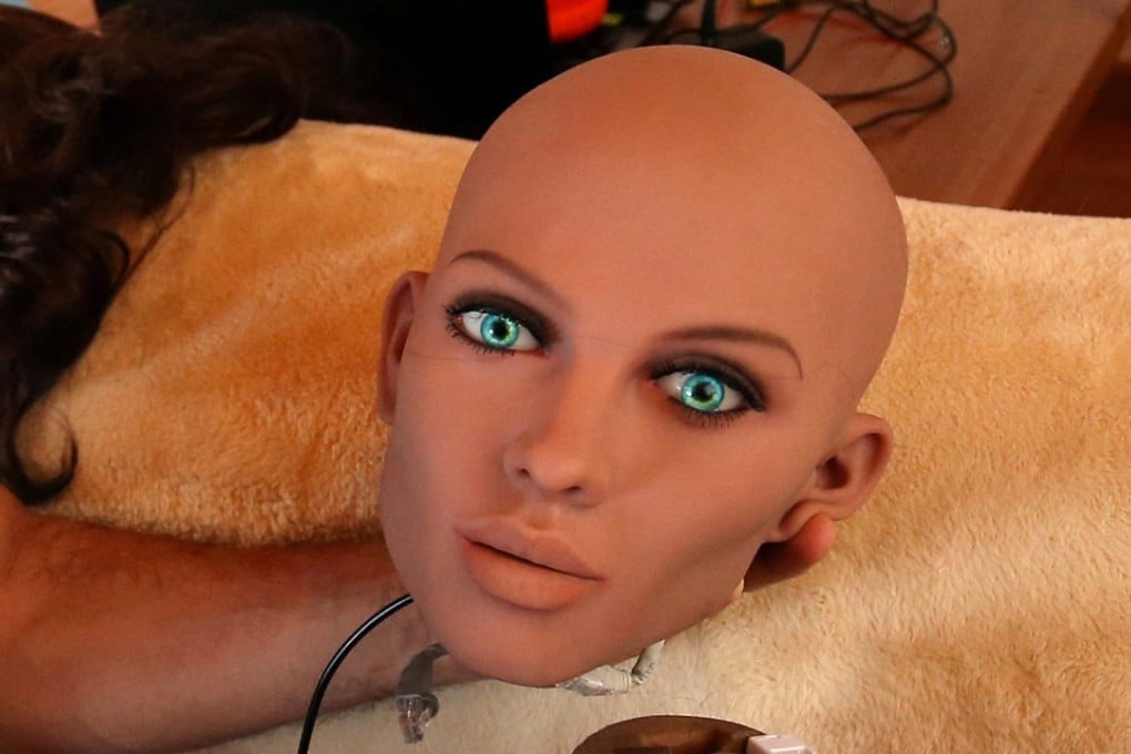 An engineer holds the head of “Samantha”, a sex doll packed with artificial intelligence. Photo: Reuters