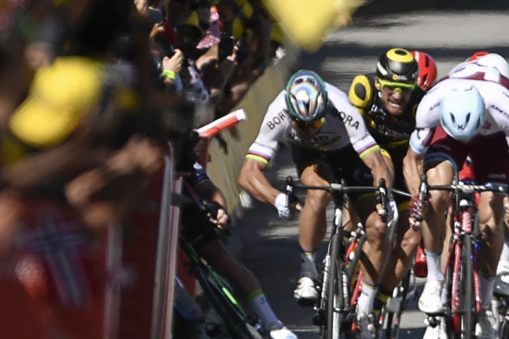 Slovakia's Peter Sagan (2ndL) gives a kick of his elbow and Great Britain's Mark Cavendish (L) falls near the finish line at the end of the 207,5 km fourth stage of the 104th edition of the Tour de France. Sagan has been disqualified from the Tour as a result of the incident. Photo: AFP