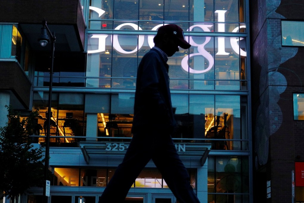 A pedestrian walks past the Google offices in Cambridge, Massachusetts. The EU has warned Google it may face more fines this year. Photo: Reuters