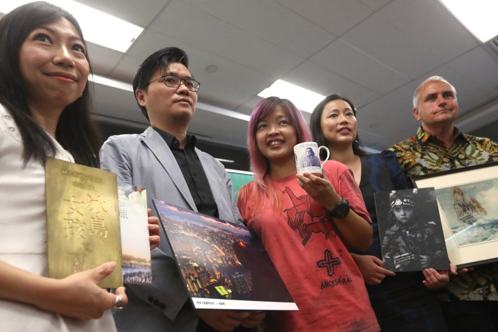 (From left) Travel writer Kam Ling; National Geographic operations director (HK) Ivan Tsoi; author Celia Cheng Kwok-yan; journalist Zhou Yijun; and local historian Jason Wordie with mementos from their travels. Photo: Nora Tam