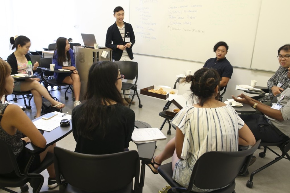 A group of university students hold a discussion on campus. To say that all young people are lazy does a disservice to the many who are committed to their studies. Photo: Dickson Lee