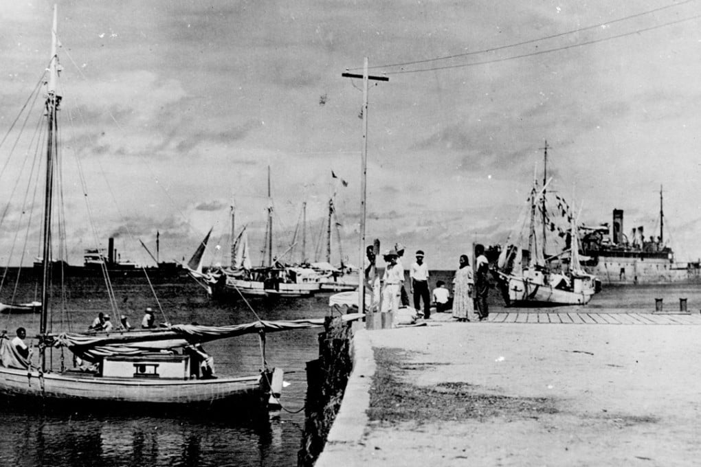 This newly uncovered photo is purported to show Amelia Earhart seated on a wharf in the Marshall Islands. Photo: A+E Networks