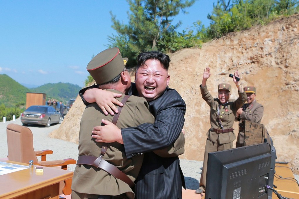 North Korean leader Kim Jong-un celebrates with scientists and technicians of the DPRK Academy of Defence Science after the test-launch of the intercontinental ballistic missile Hwasong-14 in this undated photo released by North Korea's Korean Central News Agency (KCNA) in Pyongyang July, 5, 2017. Photo: KCNA/via Reuters