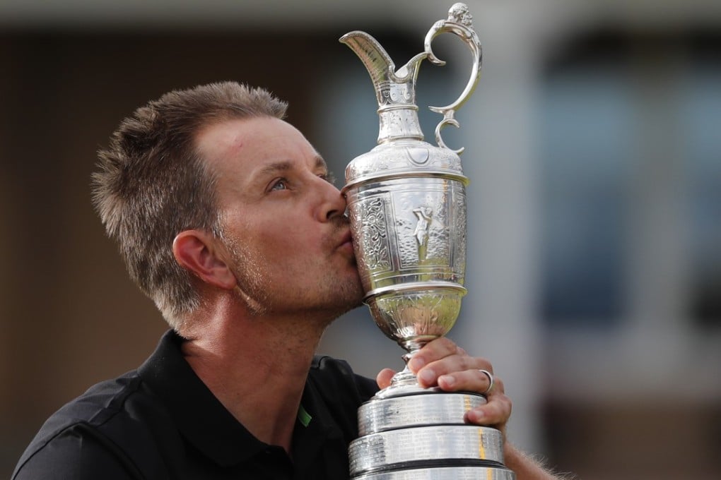 Henrik Stenson of Sweden kisses the trophy after winning the British Open Golf Championships at the Royal Troon Golf Club in Troon, Scotland. This year, the Open will pay out its prizes in US dollars, not British pounds. Photo: AP