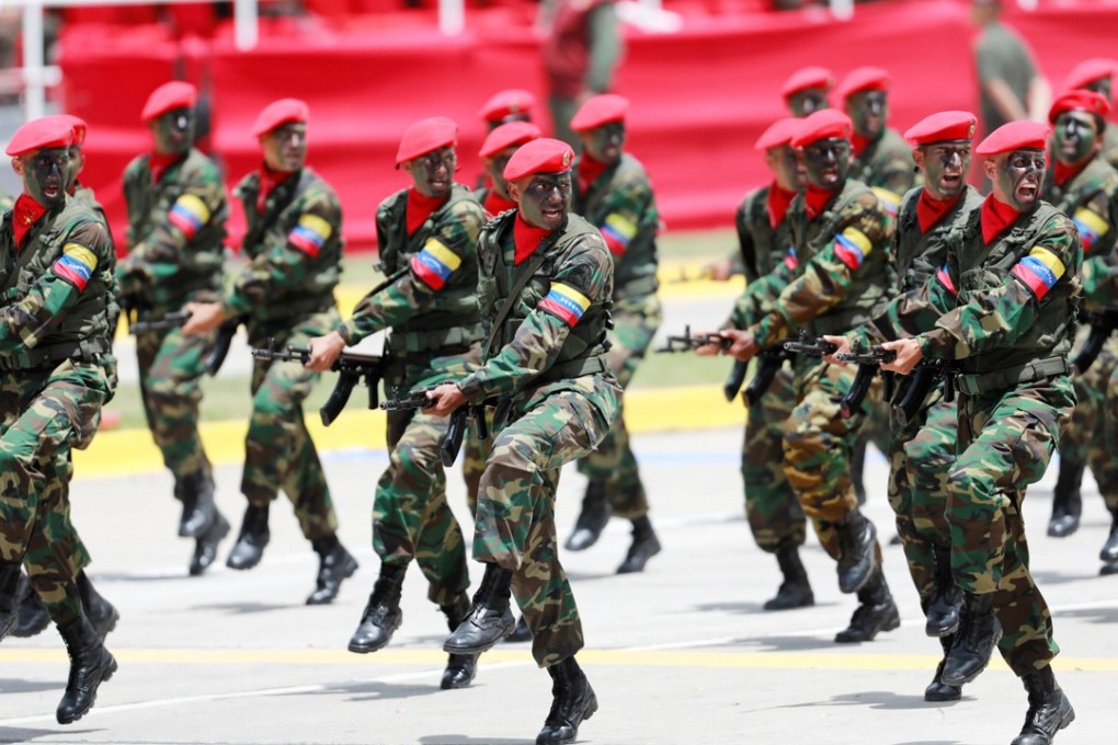 Soldiers march during a military parade to celebrate the 206th anniversary of Venezuela's independence in Caracas on Wednesday. Photo: Reuters