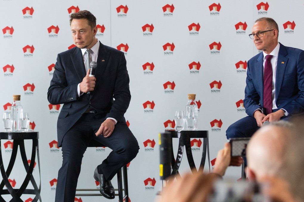 South Australian Premier Jay Weatherill and Tesla Chief Executive Officer Elon Musk listen to a question during an official ceremony in Adelaide, Australia. Photo: Reuters