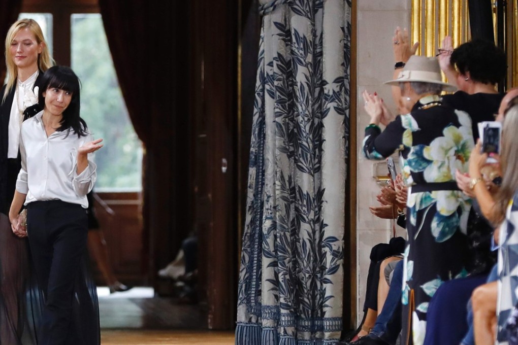 French fashion designer Bouchra Jarrar acknowledges the audience at the end of Lanvin’s 2017 spring-summer ready-to-wear collection show in Paris. Photo: AFP