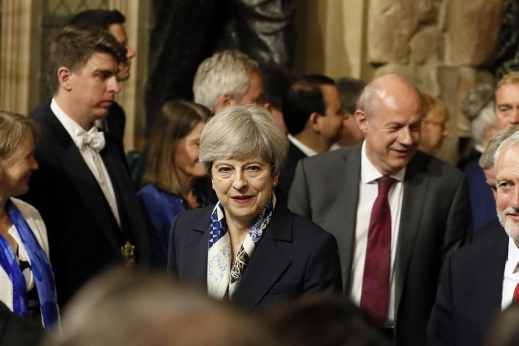 Britain's Prime Minister Theresa May (centre) and leader of the opposition Jeremy Corbyn (right). Photo: AP