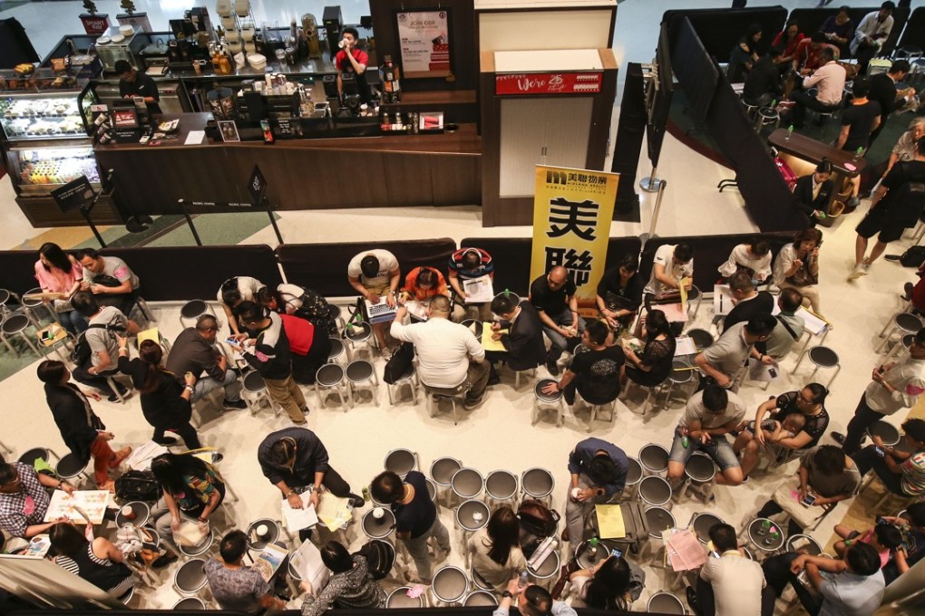 Cheung Kong Property received on average 16 registered buyers for every unit of its Ocean Pride apartments on offer, The developer sold 95 per cent of the 412 units on the first day. Photo: SCMP/ David Wong