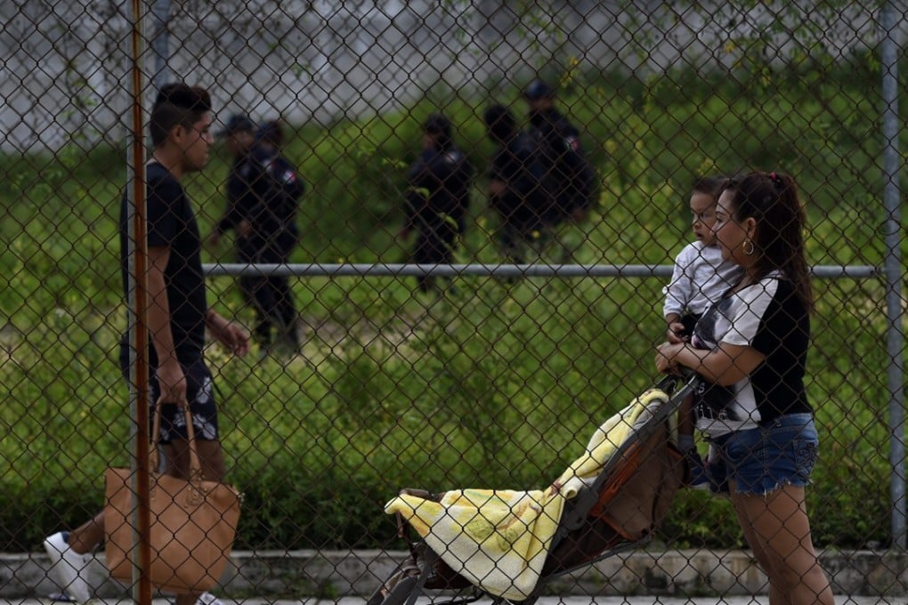 Visitors at the entrance of Las Cruces prison in Acapulco. Photo: AFP