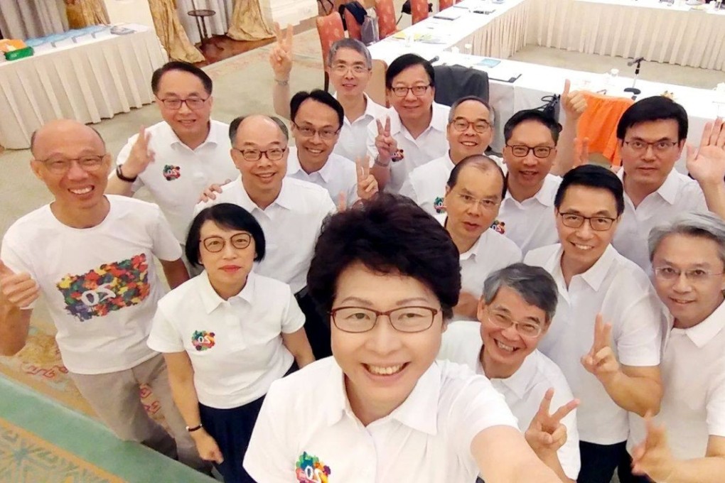 Carrie Lam poses for a selfie with her ministers. Photo: Facebook