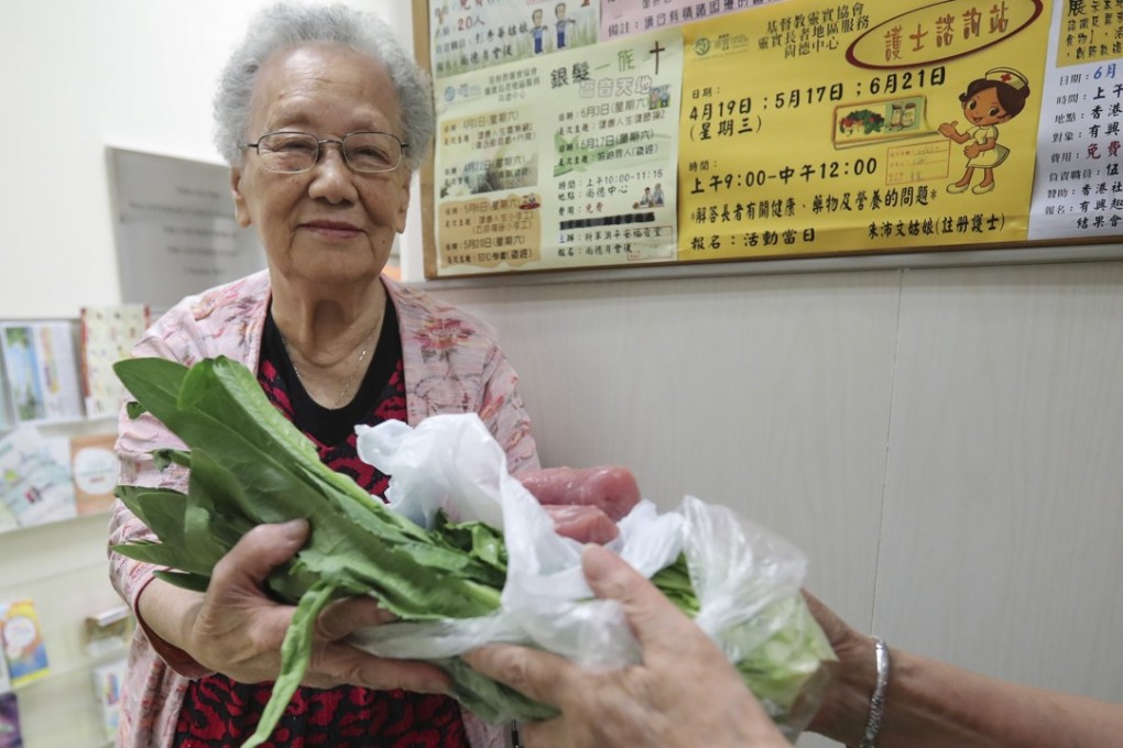 Ng Sau-lan, 91, picks up fresh food twice a week from a Haven of Hope centre in Tseung Kwan O. Photo: Edward Wong