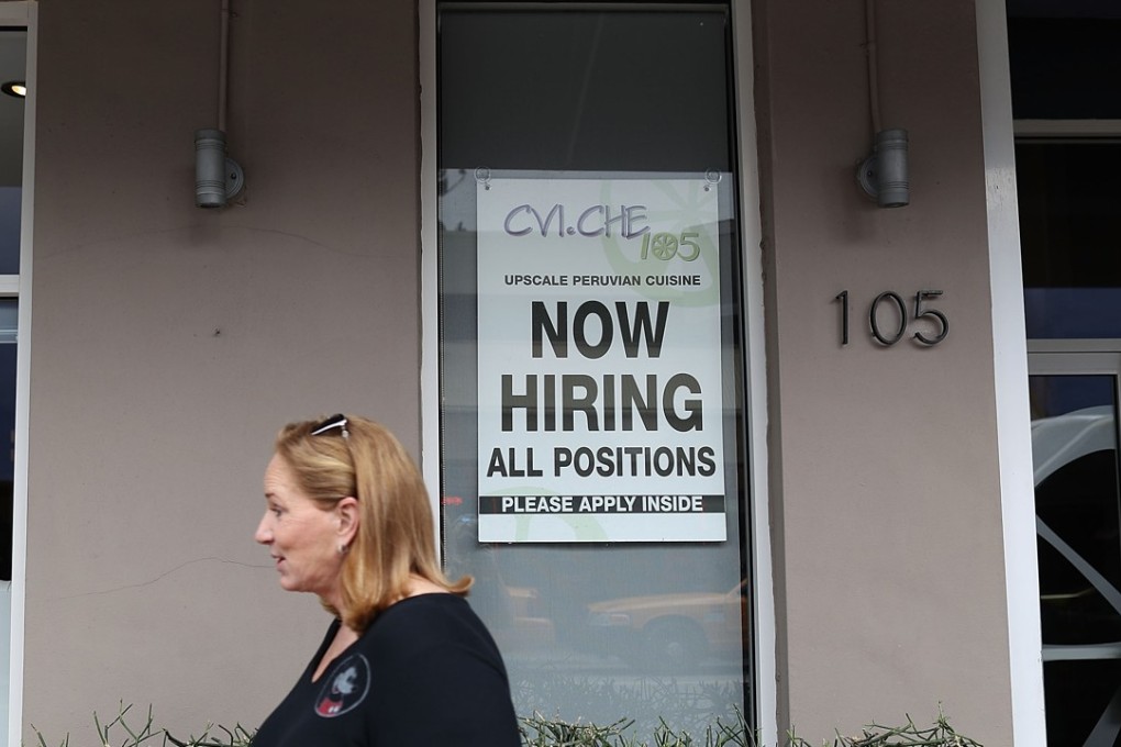 A "Now Hiring" sign IS seen in Miami, Florida. US job creation rebounded in June while the unemployment rate ticked higher as more people entered the work force in search of jobs, the Labour Department said on July 7, 2017. Photo: AFP