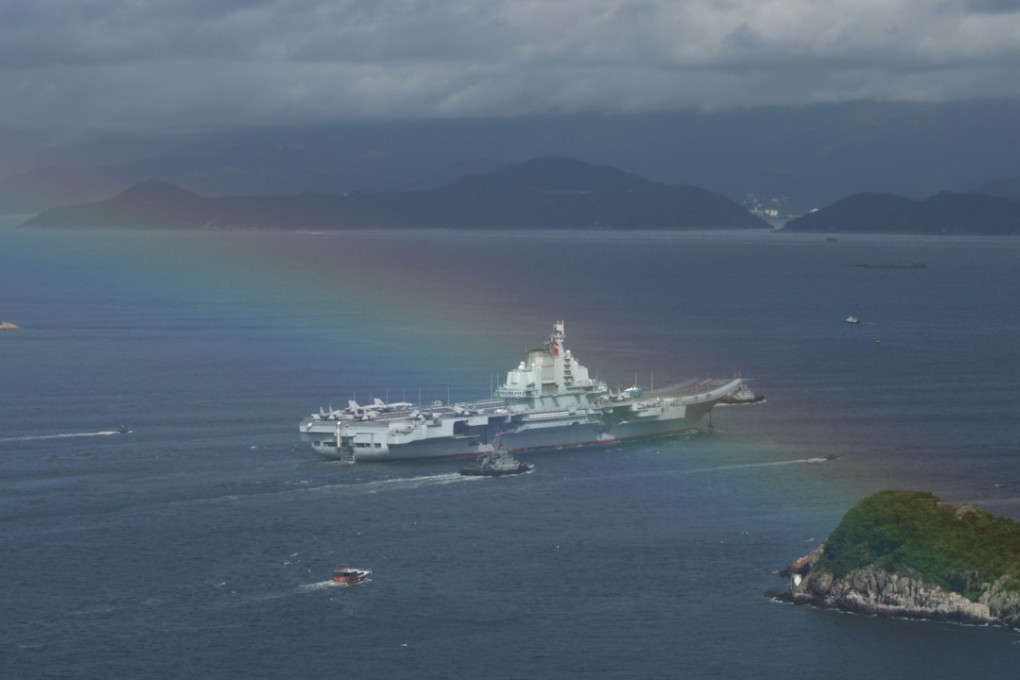 China's Liaoning aircraft carrier and its escort sails into Victoria Harbour on Friday morning. Photo: Sam Tsang