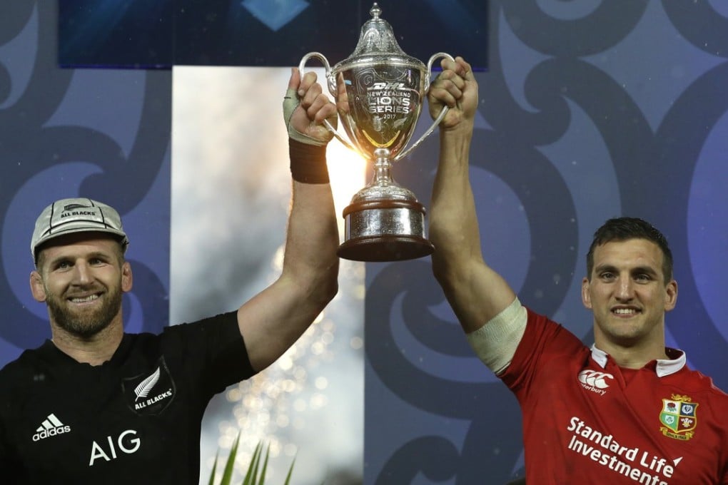 New Zealand captain Kieran Read (left) and Lions captain Sam Warburton hold the trophy after the third test at Eden Park ends in a draw. Photo: AP