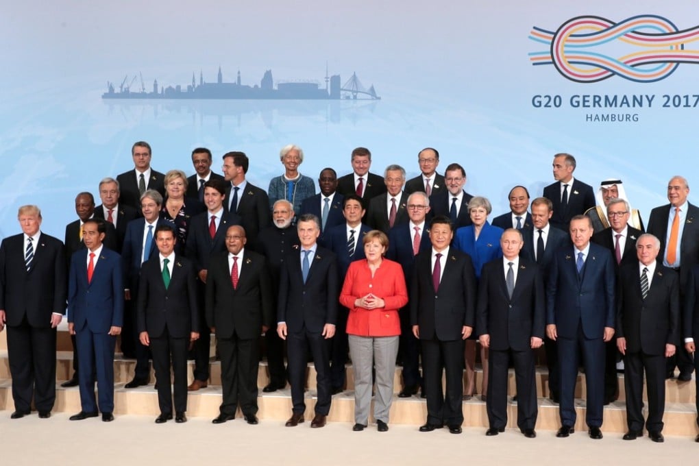 G20 leaders line up for the traditional summit ‘family’ photo in Hamburg. Photo: EPA