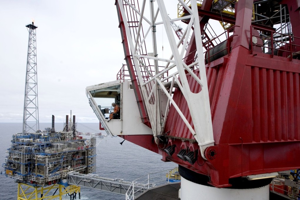 A worker sits inside a crane on the Sleipner gas platform, some 250km off Norway's coast in the North Sea. File photo: AFP