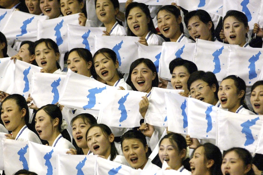 North Korean women hold "unification flags" at Daegu Universiade Game in Daegu, South Korea. Seven months ahead of the Pyeongchang Olympics, many in South Korea, including new liberal President Moon Jae-in, hope to use the Games as a venue to promote peace with rival North Korea. To do so, the North’s participation is essential, but an ongoing nuclear tension and a lack of winter sports athletes in North Korea could ruin the attempts at reconciliation. (AP Photo/ Lee Jin-man, File)