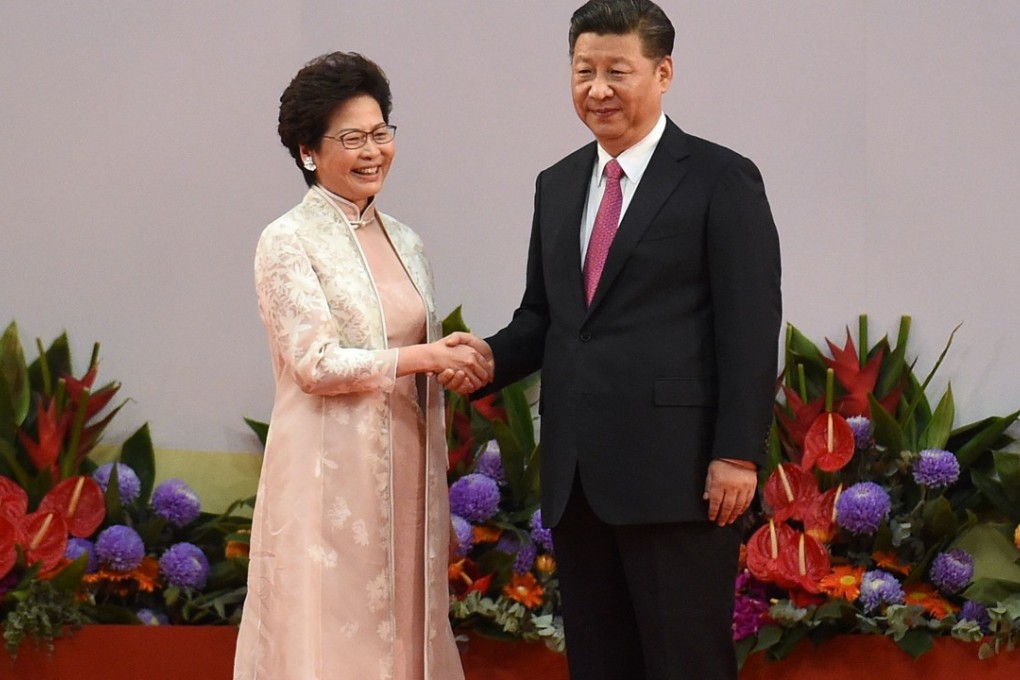 Chief Executive Carrie Lam is greeted by President Xi Jinping after she was sworn in as Hong Kong’s new leader, at the Convention and Exhibition Centre on July 1. Photo: AFP