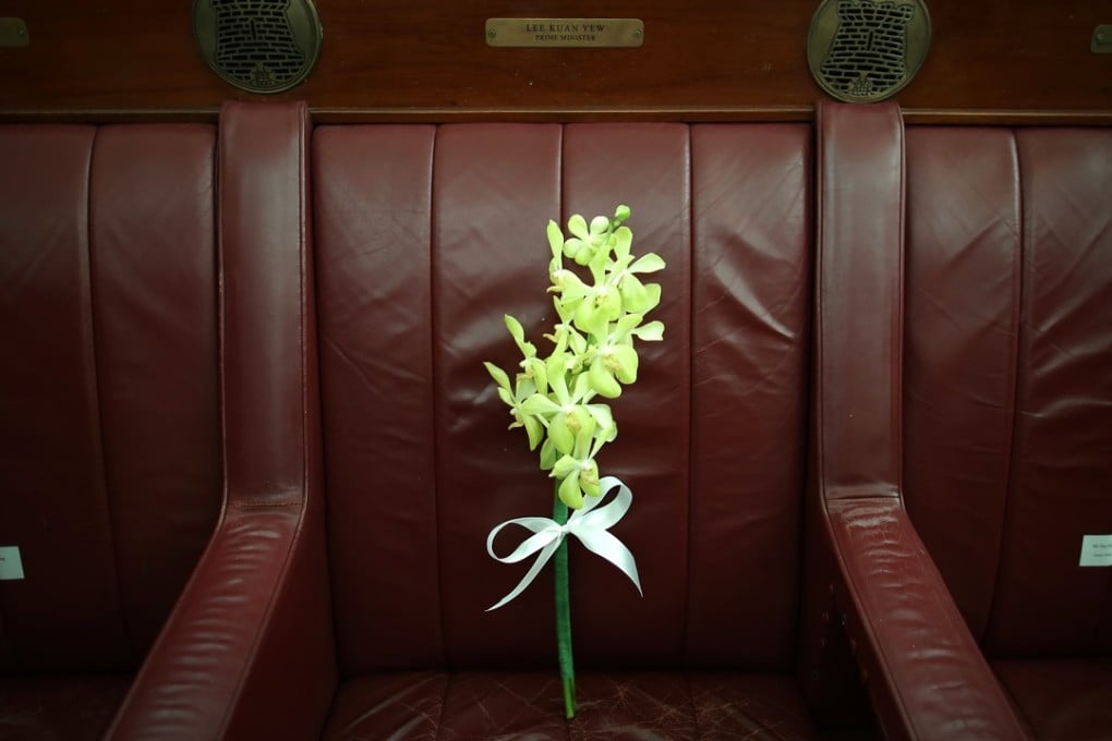 Orchids are placed on the seat belonging to the late Lee Kuan Yew at the former Parliament House during a remembrance ceremony held last year to mark the first anniversary of the death of Singapore's founding prime minister. Singapore proves that clean government and rule of law work. It took more than a single leader to make this happen, but Lee was their guide. Photo: AP