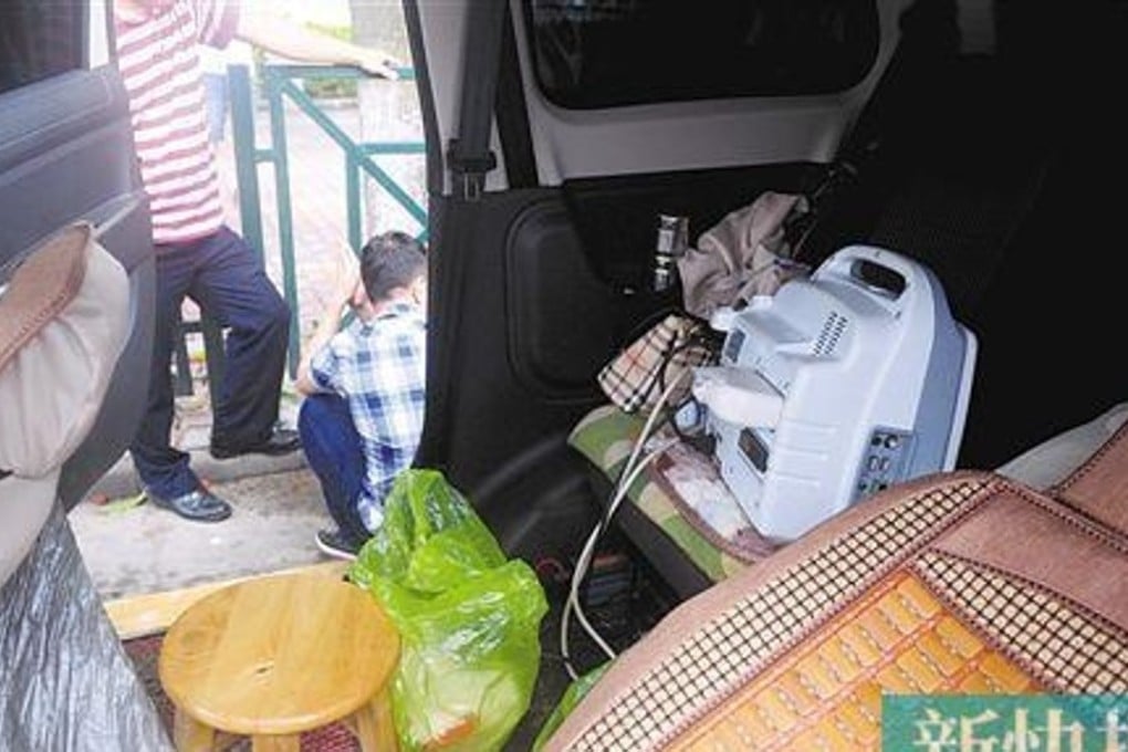 The brother is seen crouched down beside the minivan that doubled as a gender determination clinic. Photo: Handout