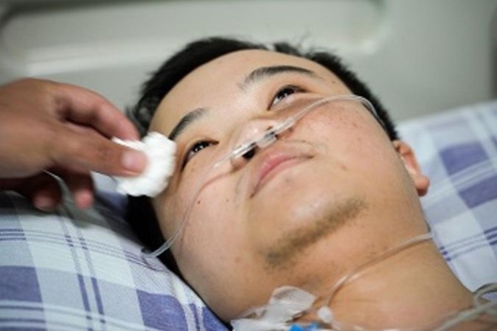 Xu Qiankai recovers in hospital after having the lower part of his right leg amputated. Photo: Handout