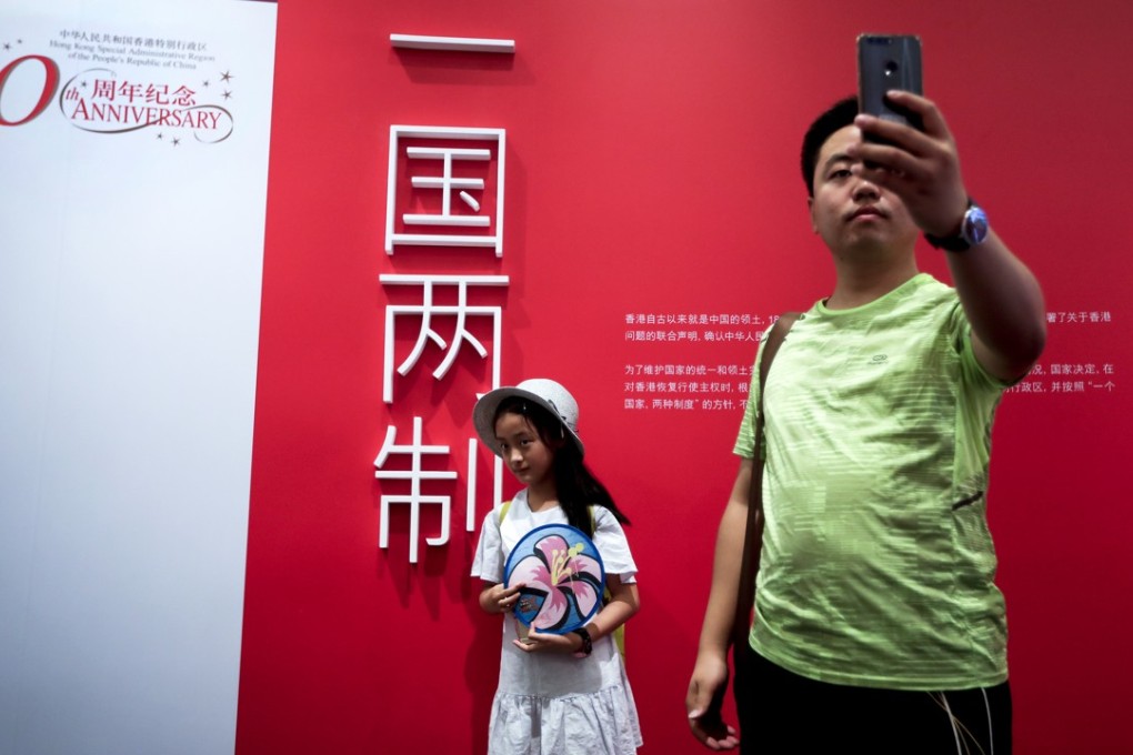 Hongkongers were asked to give their thoughts on ‘one country, two systems’ 20 years after the handover. Photo: AP