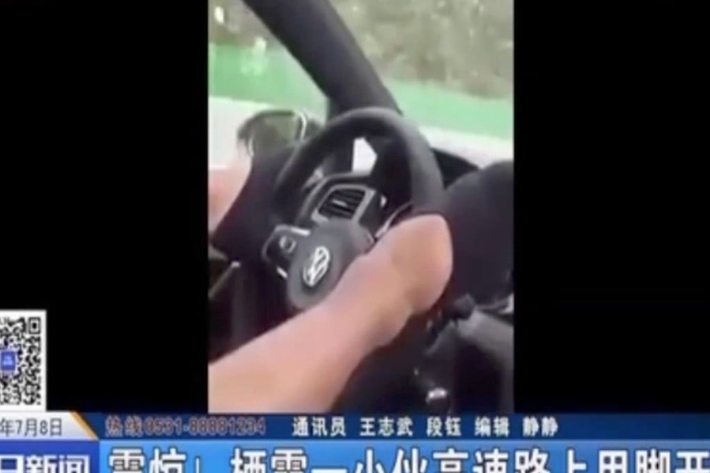 A still from the video showing the man driving with his feet. Photo: Handout