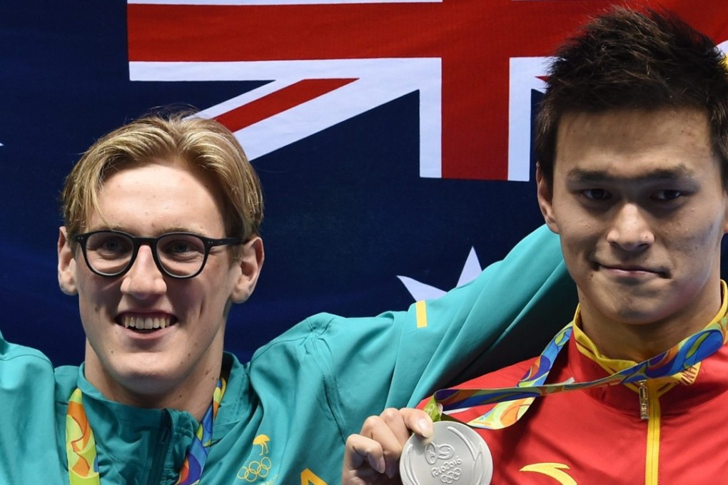 Gold medallist Mack Horton of Australia with Sun Yang of China after the men’s 400m freestyle final at the 2016 Olympics in Rio. Photo: EPA