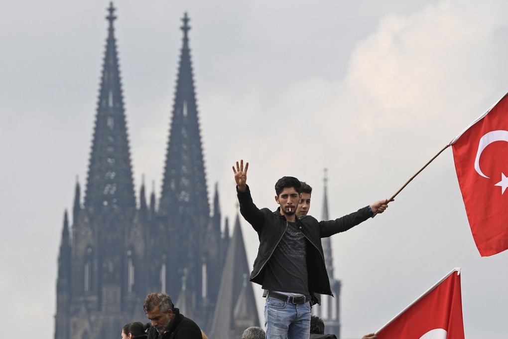 Thousands of supporters of Turkish President Recep Tayyip Erdogan gathered in the German city of Cologne in 2016 for a demonstration against the failed July 15 coup in Turkey. File photo: AP