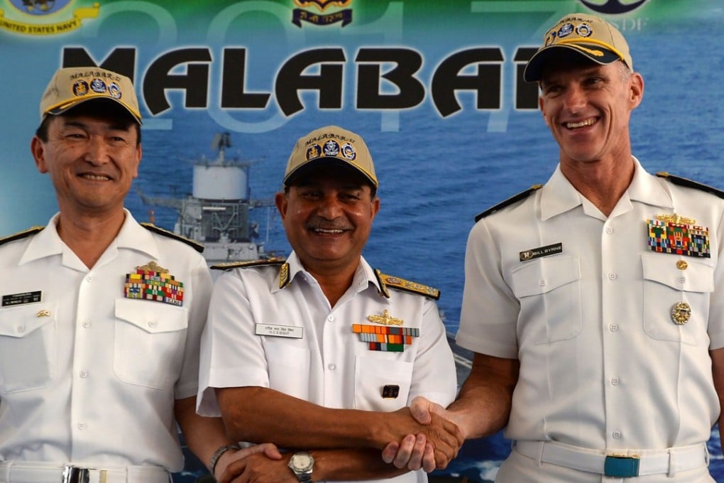 Japanese Rear Admiral Hiroshi Yamamura (L), US Rear Admiral William Byrne (R) and HCS Bisht, vice admiral of the Indian Navy. Photo: AFP