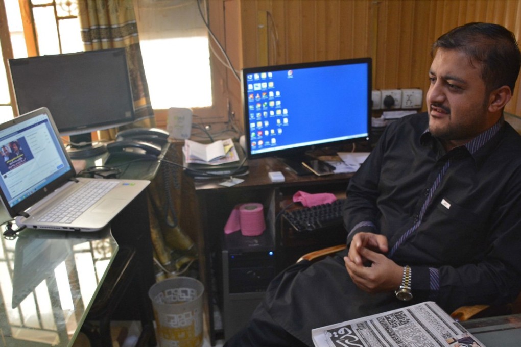 Journalist Zafar Achakzai, who was held for sharing content criticising security forces on social media, in his office in Quetta, Pakistan. Photo: AP
