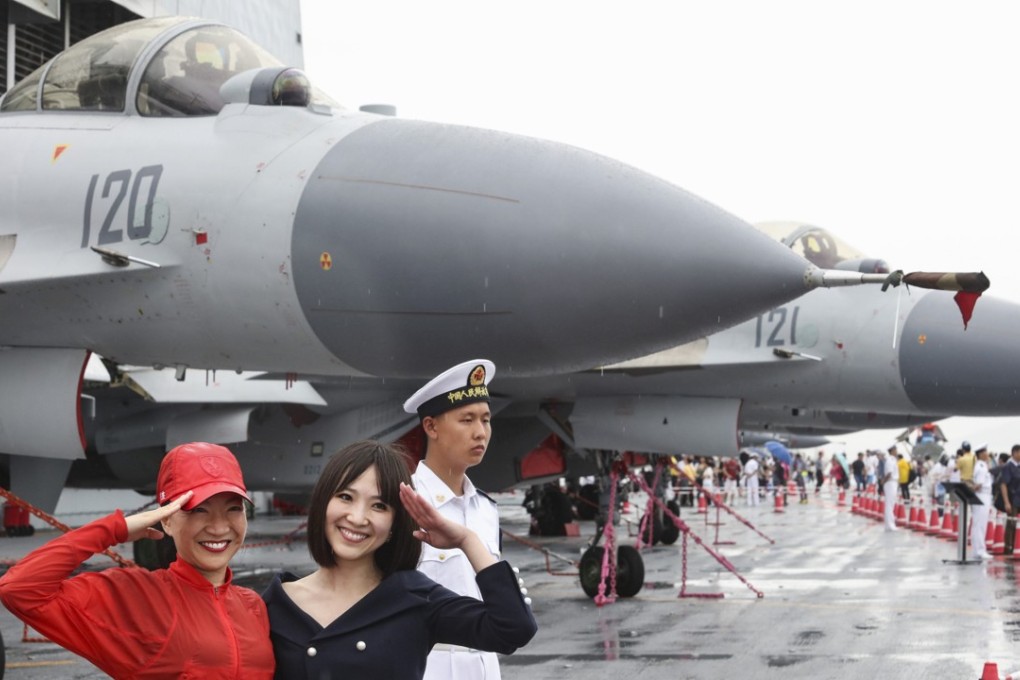 J-15 fighter jets were parked on deck as public visitors visited the aircraft carrier Liaoning. Photo: Felix Wong