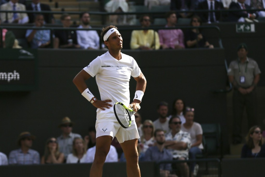 Spain's Rafael Nadal reacts after losing a point against Luxembourg's Gilles Muller on day seven at the Wimbledon Tennis Championships in London on Monday, July 10, 2017. Nadal lost in the 5-set match, dropping the last set 15-13. Photo: AP