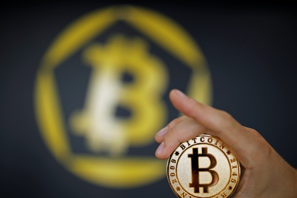 A Bitcoin (virtual currency) coin is seen in an illustration picture taken at La Maison du Bitcoin in Paris, France. Photo: REUTERS/Benoit Tessier/Illustration