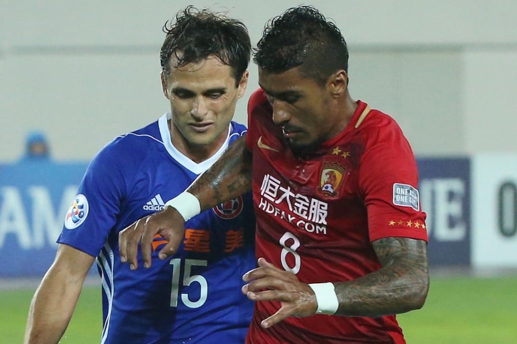 Guangzhou Evergrande’s Paulinho (right) in action. Photo: K. Y. Cheng