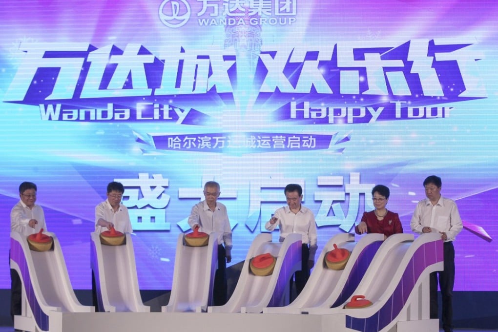 The official opening of Wanda City in Harbin on June 30, attended by Wang Jianlin (centre, right). Just over a week later Wang announced the sale of the assets to Sunac. Photo: Simon Song