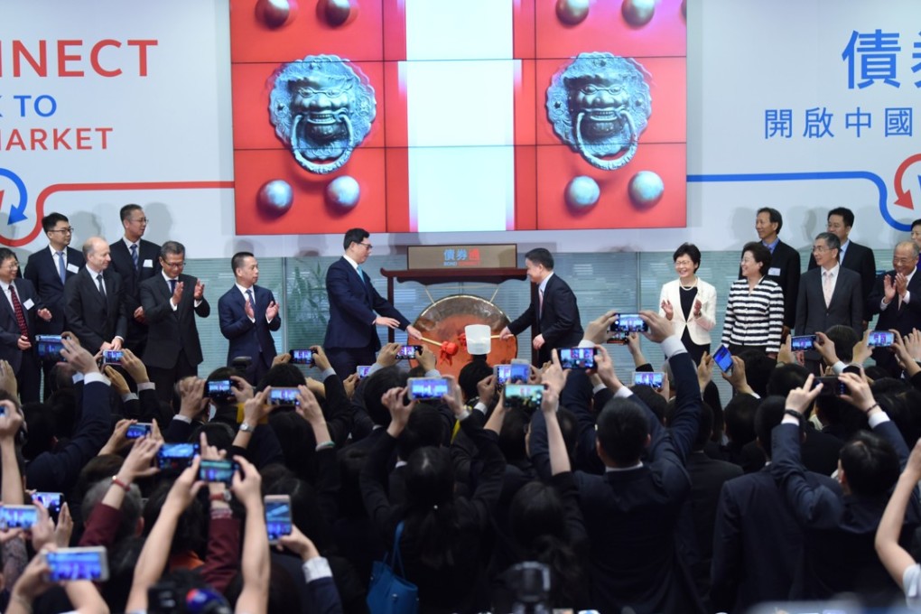 Officials mark the start of northbound trading on the mainland-Hong Kong Bond Connect on July 3 in Hong Kong. The addition of onshore stocks into MSCI’s index family and the latest expansion of the Connect scheme will serve the vital goal of enticing foreign ownership of mainland assets. Photo: Xinhua