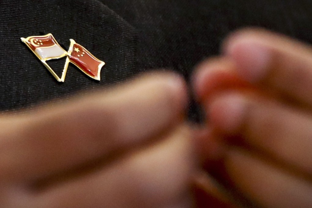 A pin bearing the Singapore and Chinese national flags is worn by Singapore’s Foreign Minister Vivian Balakrishnan, during a joint press conference with Chinese Foreign Minister Wang Yi last month at the Ministry of Foreign Affairs in Beijing. Photo: AP
