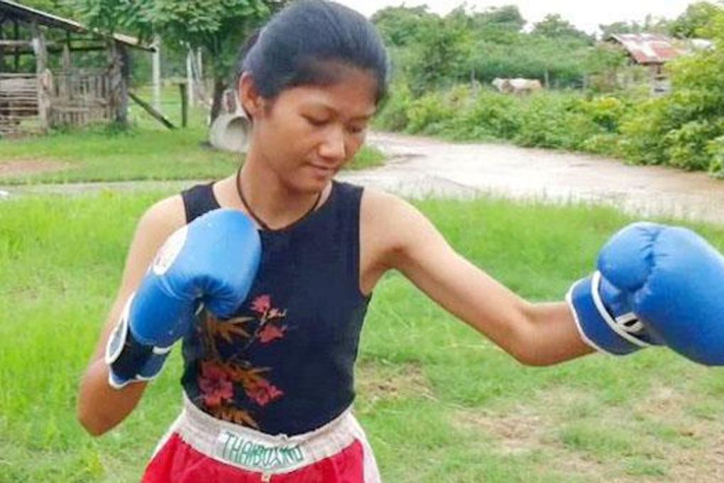 Wijitra "Ann" Boon-in, 14, strikes a martial pose for a photograph at her house in Sukhothai province on Wednesday. Photo: Phubet Faithes